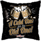 Decorative pillow with beer mugs and text 'A Cold One for the Old One' on a black background.