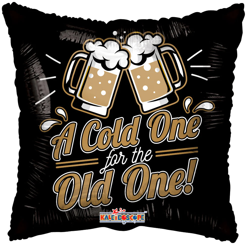 Decorative pillow with beer mugs and text 'A Cold One for the Old One' on a black background.