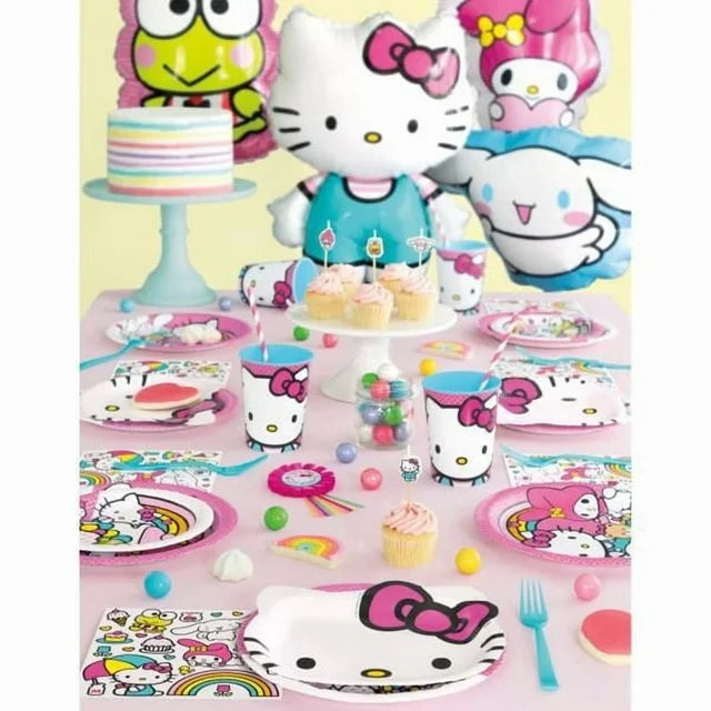 Colorful table setting with Hello Kitty-themed plates, cups, and decorations on a pink tablecloth.