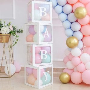 Colorful pastel baby balloons in clear boxes with white letters spelling BABY.