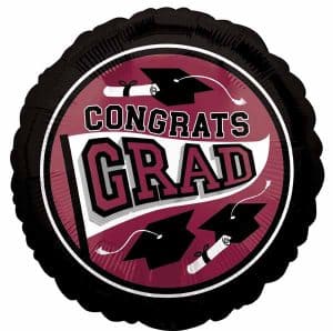 Graduation cap and diploma on a congratulatory balloon for graduation celebration.